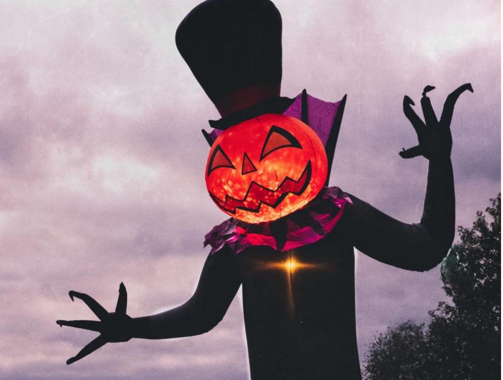 Inflatable Halloween decoration with a pumpkin head and top hat