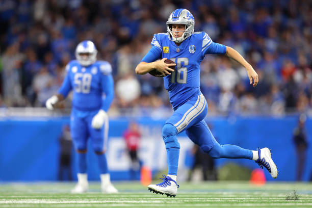 DETROIT, MICHIGAN - NOVEMBER 19: Jared Goff #16 of the Detroit Lions runs with the ball during the second quarter of a game against the Chicago Bears at Ford Field on November 19, 2023 in Detroit, Michigan. (Photo by Rey Del Rio/Getty Images)