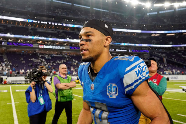 MINNEAPOLIS, MINNESOTA - DECEMBER 24: Amon-Ra St. Brown #14 of the Detroit Lions walks off the field after the game against the Minnesota Vikings at U.S. Bank Stadium on December 24, 2023 in Minneapolis, Minnesota. The Lions defeated the Vikings 30-24. 