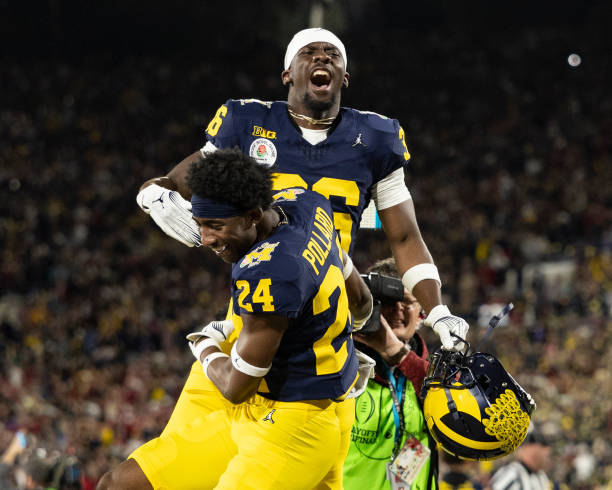 PASADENA, CA - JANUARY 1: Keshaun Harris #36 and Myles Pollard #24 of the Michigan Wolverines celebrate the Michigan victory in the Rose Bowl during a game between University of Alabama and University of Michigan at the Rose Bowl on January 1, 2024 in Pasadena, California. 