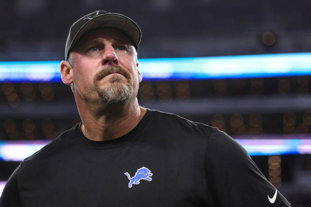 ARLINGTON, TX - DECEMBER 30: Head coach Dan Campbell of the Detroit Lions looks on from the field during warmups prior to an NFL football game against the Dallas Cowboys at AT&T Stadium on December 30, 2023 in Arlington, Texas. (Photo by Perry Knotts/Getty Images)