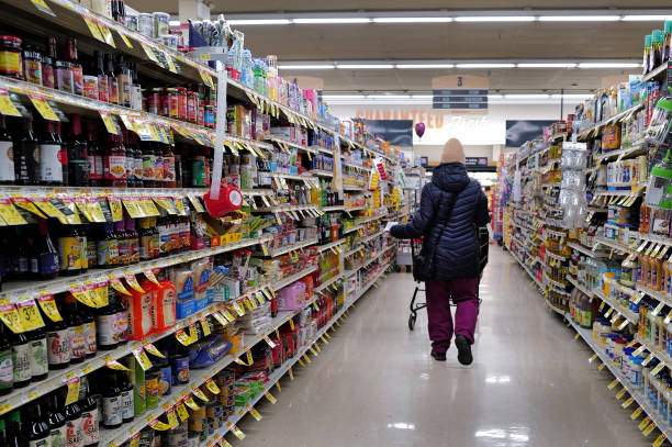CHICAGO, ILLINOIS - FEBRUARY 13: A customer shops at a grocery store on February 13, 2024 in Chicago, Illinois. 